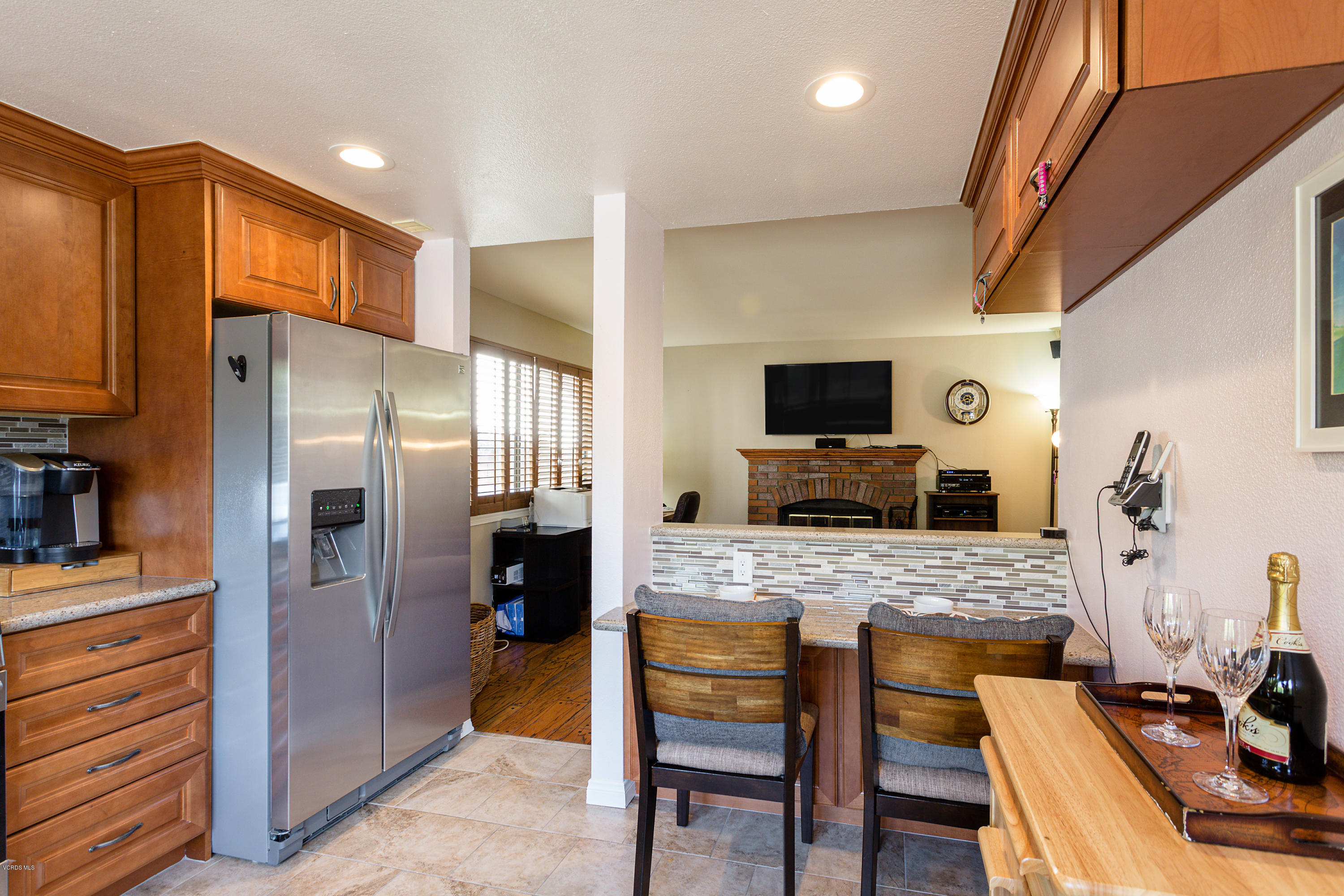 19641 Turtle Springs Way Porter Ranch, CA 91326 - Photo 13 of 31 a kitchen with stainless steel appliances granite countertop a refrigerator stove microwave and sink