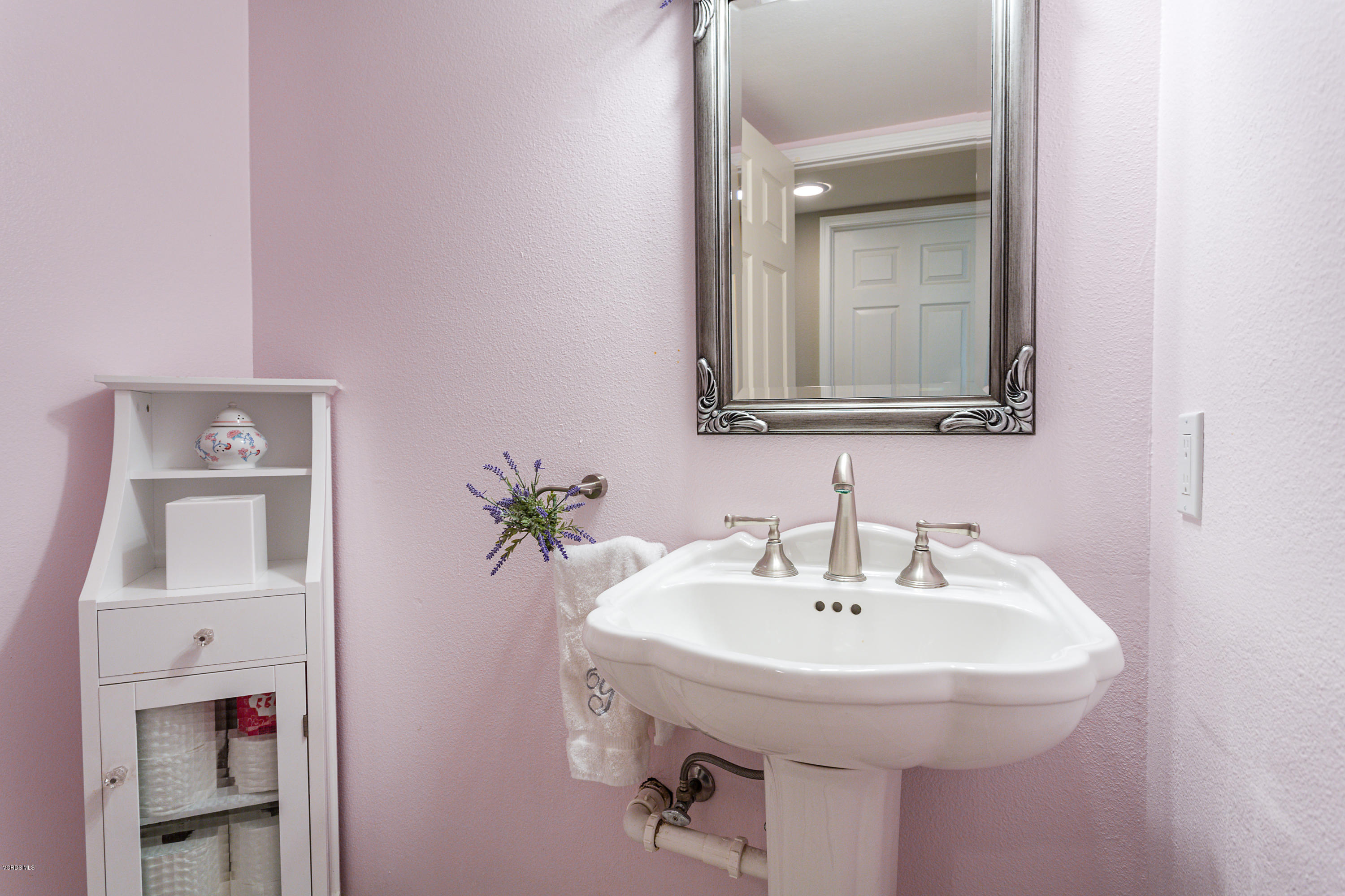 19641 Turtle Springs Way Porter Ranch, CA 91326 - Photo 16 of 31 a bathroom with a sink and a mirror