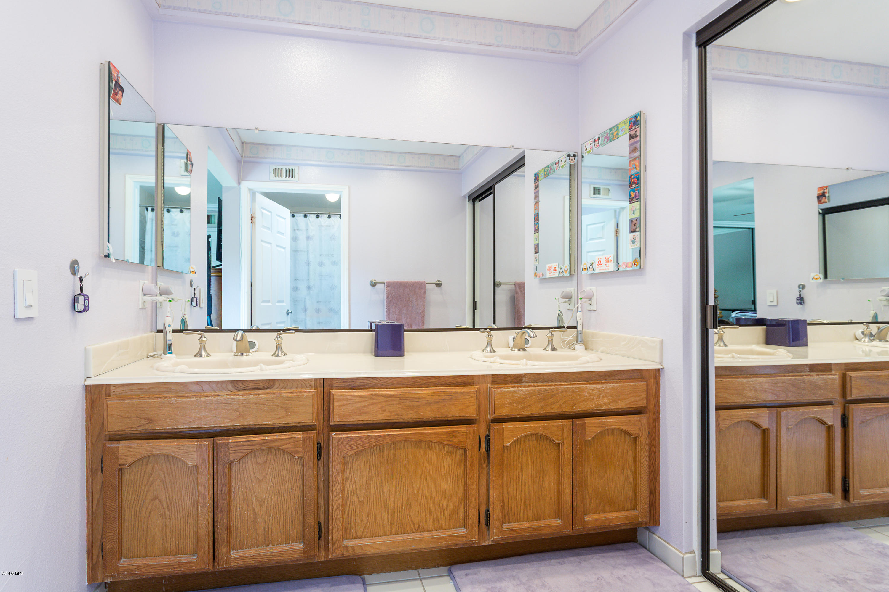 19641 Turtle Springs Way Porter Ranch, CA 91326 - Photo 20 of 31 a spacious bathroom with a sink and a mirror