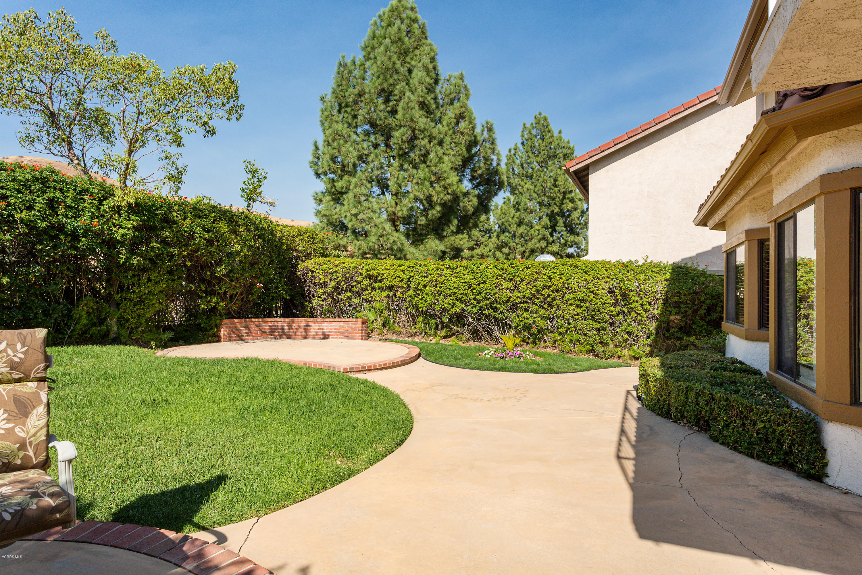 19641 Turtle Springs Way Porter Ranch, CA 91326 - Photo 26 of 31 a view of a backyard with potted plants