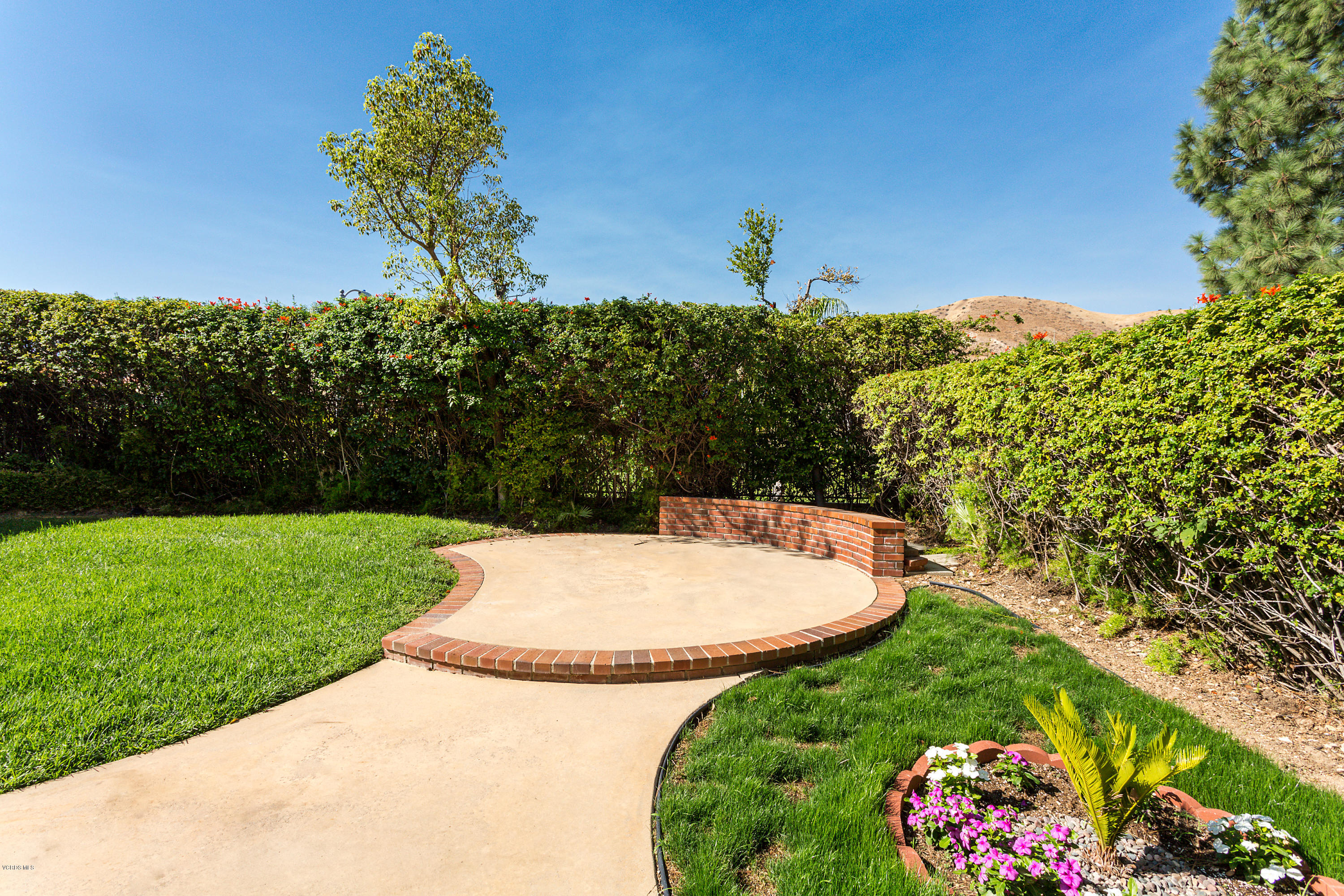 19641 Turtle Springs Way Porter Ranch, CA 91326 - Photo 27 of 31 a view of a garden with a flower in a garden