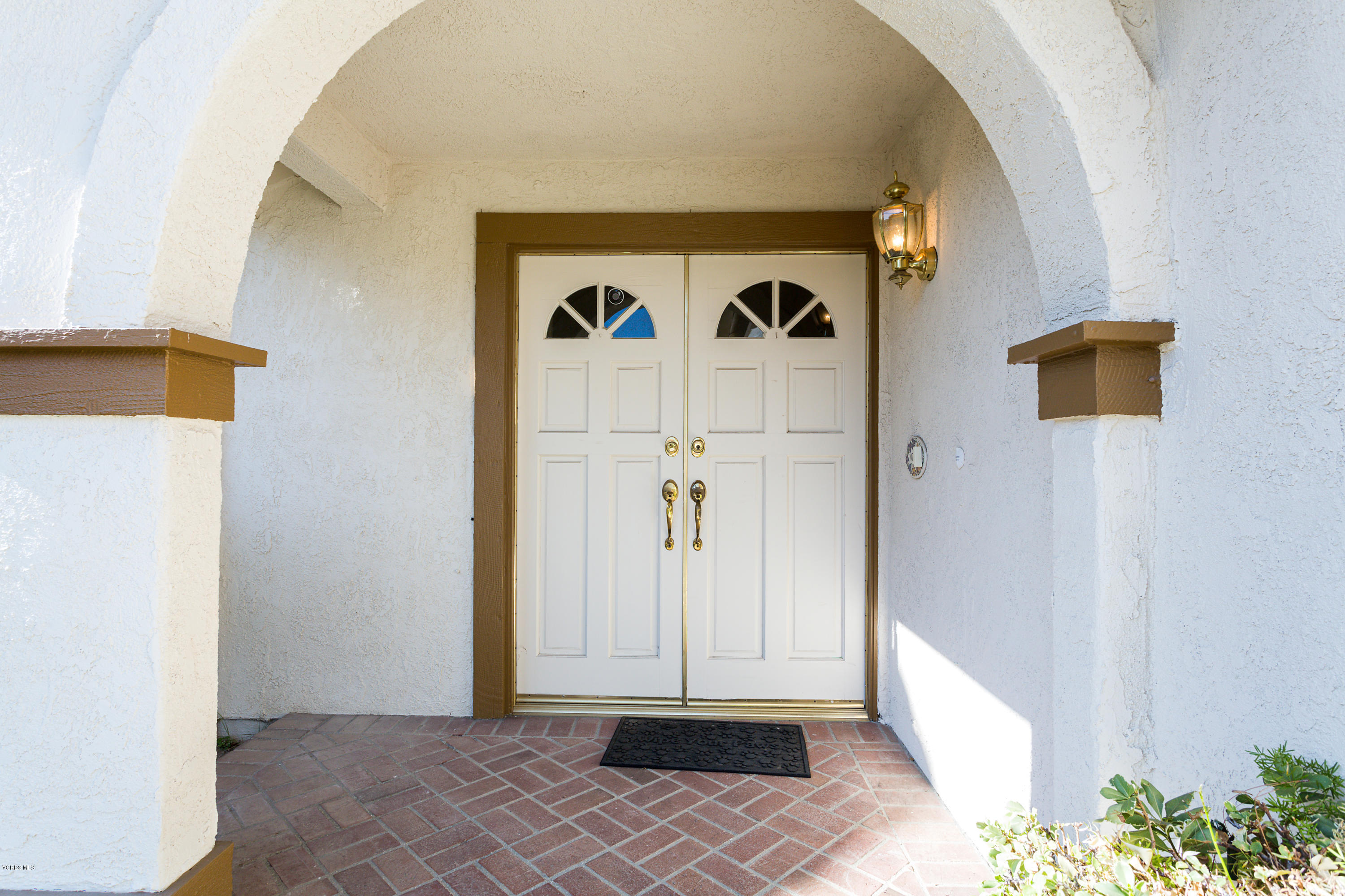 19641 Turtle Springs Way Porter Ranch, CA 91326 - Photo 6 of 31 a view of a hallway with wooden door