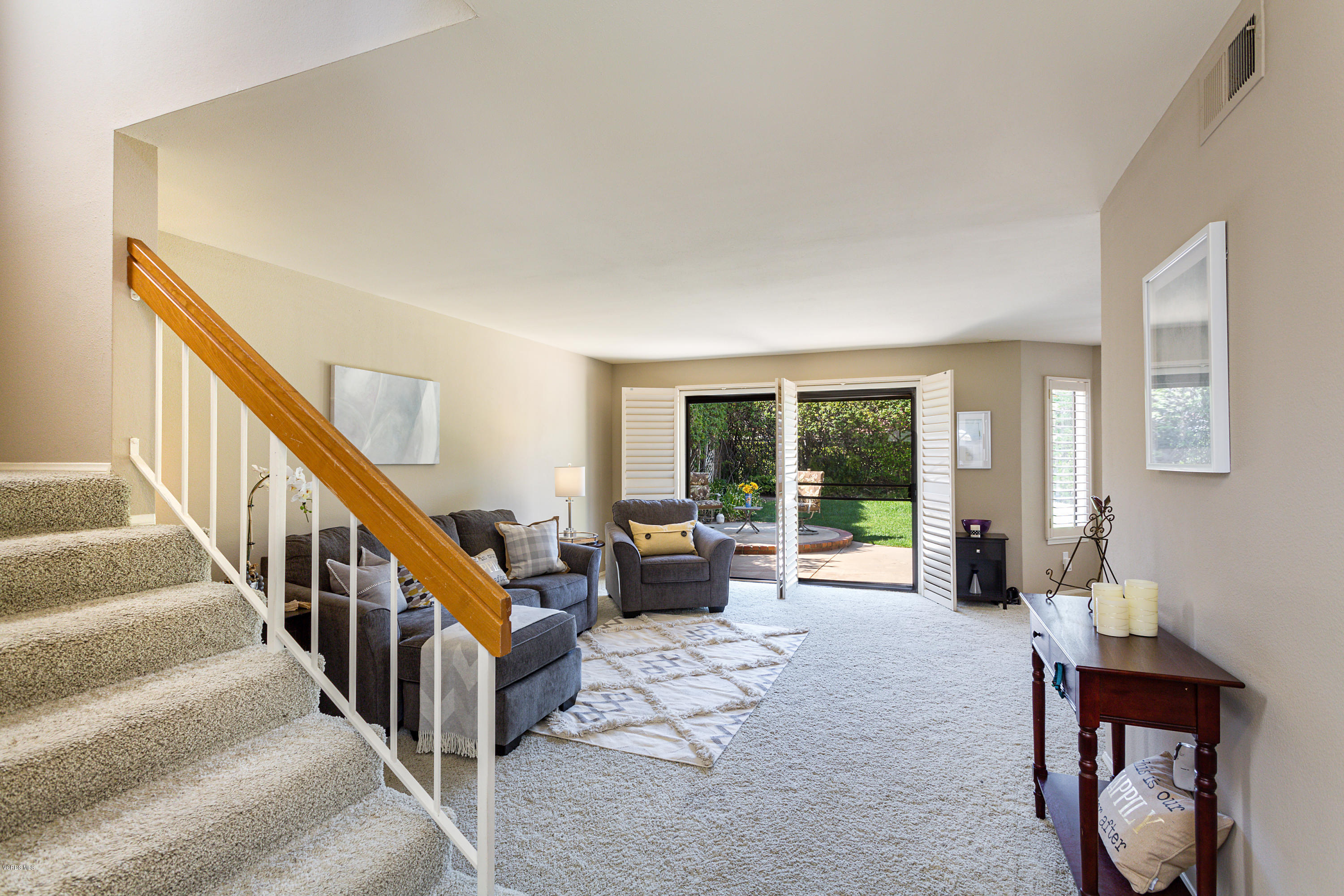 19641 Turtle Springs Way Porter Ranch, CA 91326 - Photo 7 of 31 a living room with furniture and large windows