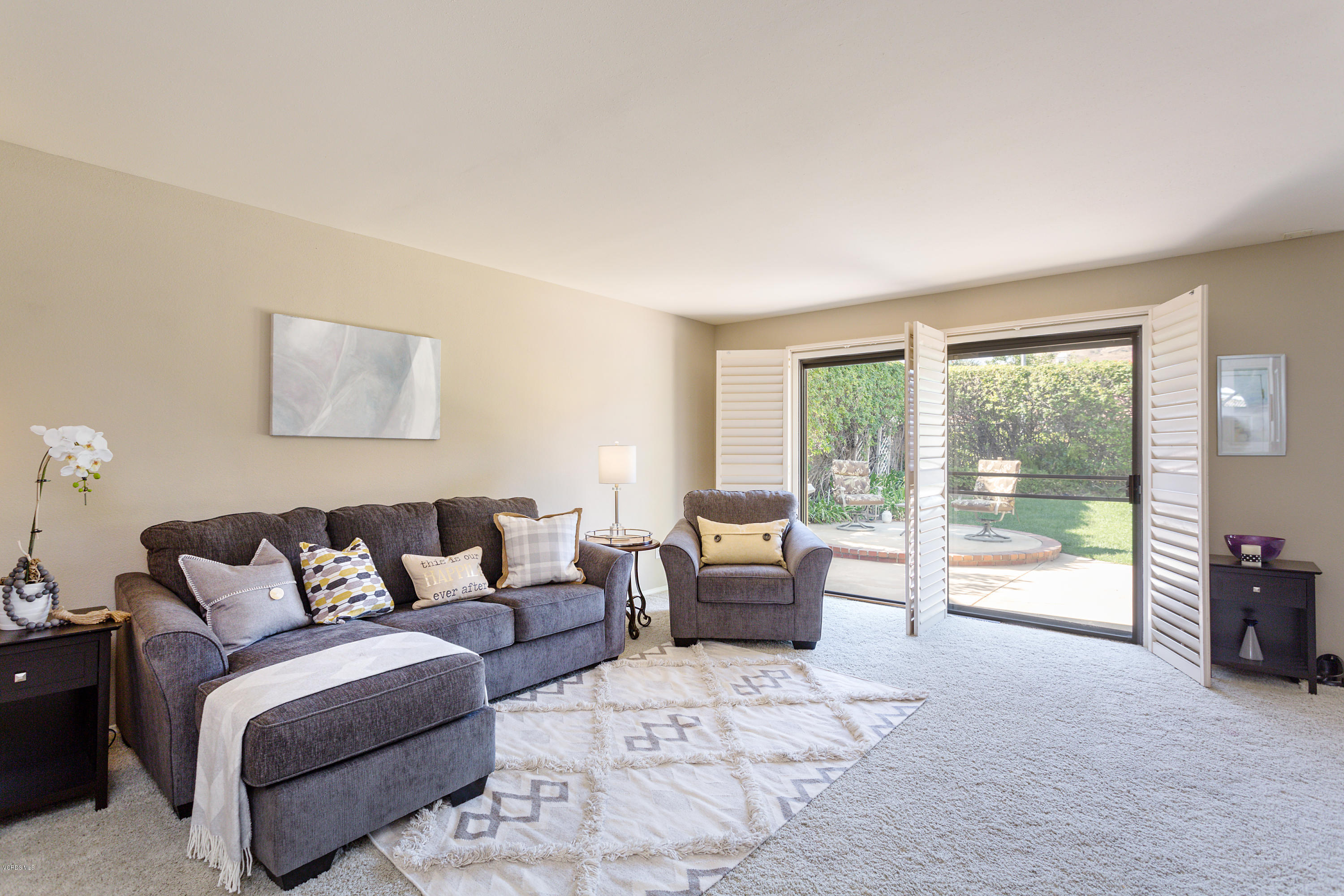 19641 Turtle Springs Way Porter Ranch, CA 91326 - Photo 8 of 31 a living room with furniture and a large window with outer view