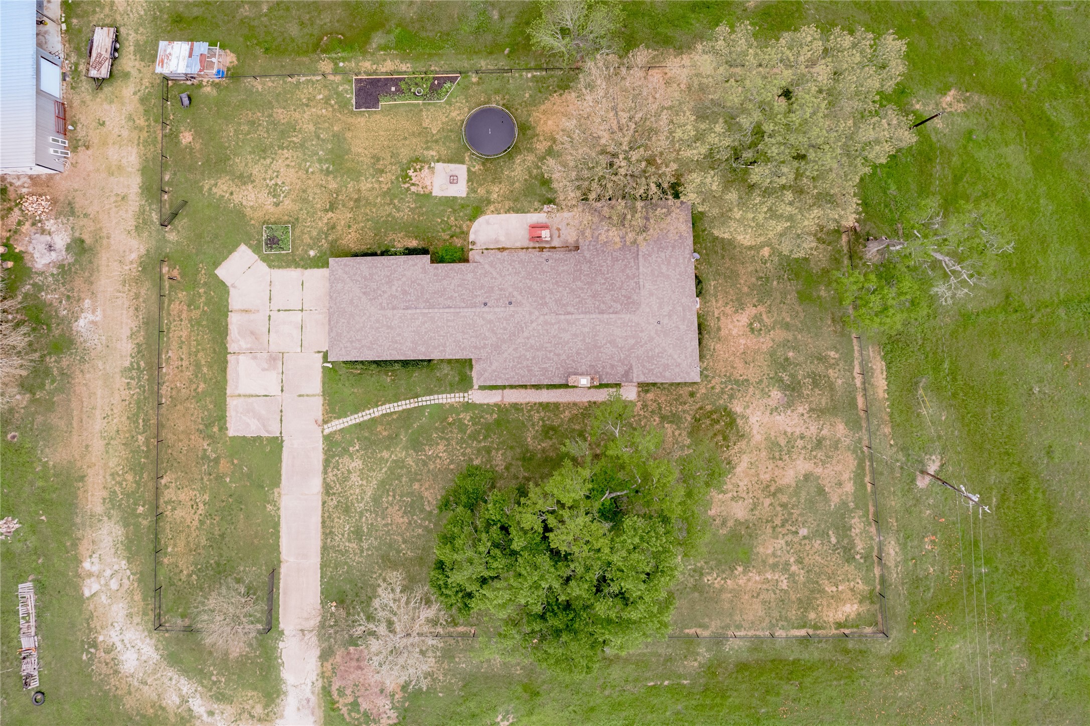 758 Wire Road Huntsville, TX 77320 - Photo 5 of 44 an aerial view of a house with a yard