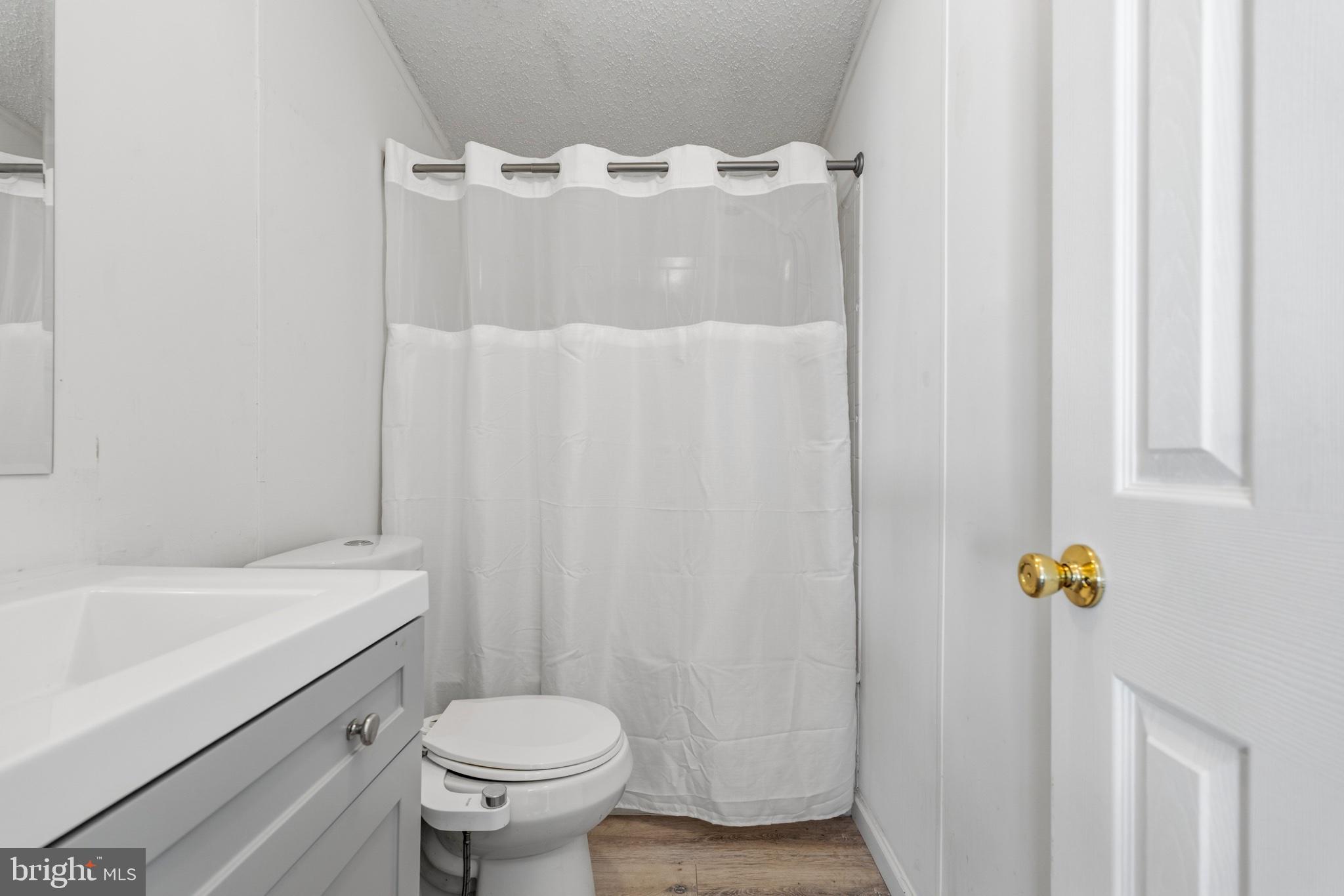 227 Forest Green Road Aberdeen, MD 21001 - Photo 18 of 23 a bathroom with a sink toilet and shower