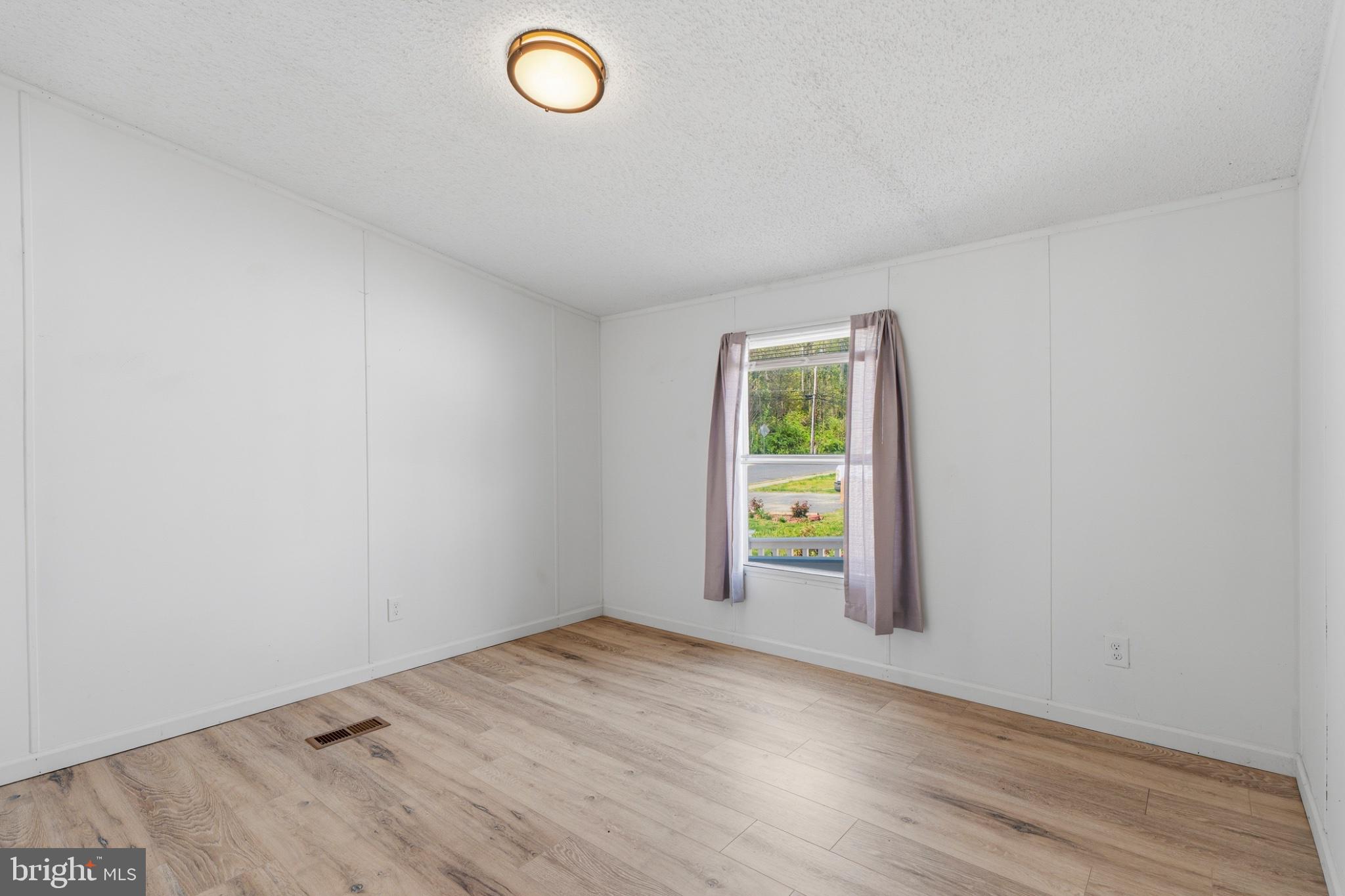 227 Forest Green Road Aberdeen, MD 21001 - Photo 19 of 23 an empty room with a empty space and window