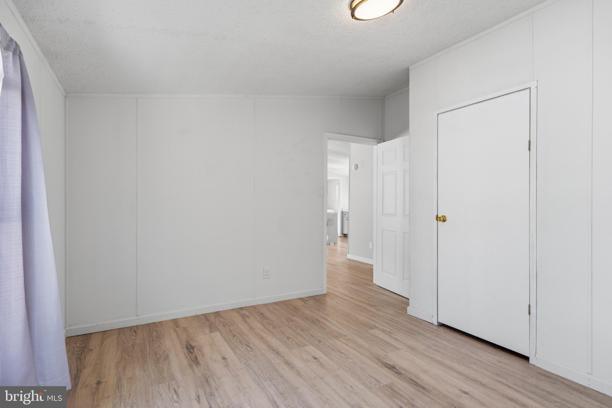 227 Forest Green Road Aberdeen, MD 21001 - Photo 20 of 23 a view of an empty room with wooden floor