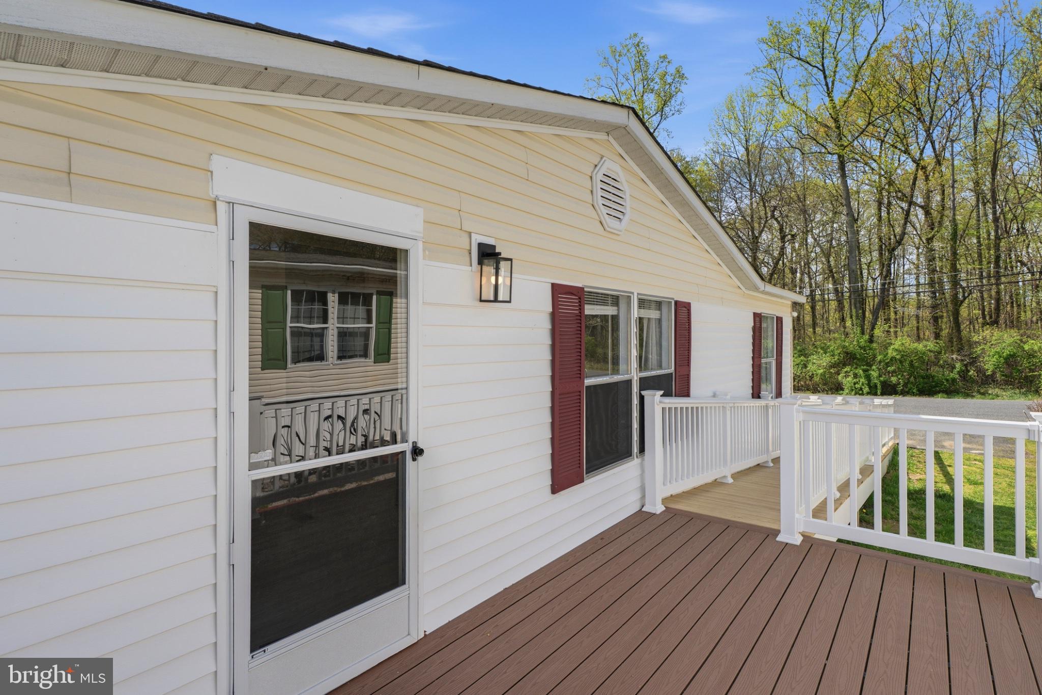 227 Forest Green Road Aberdeen, MD 21001 - Photo 2 of 23 a view of house with deck and wooden floor