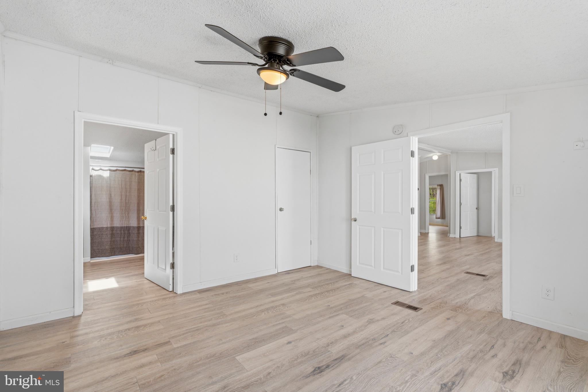 227 Forest Green Road Aberdeen, MD 21001 - Photo 7 of 23 a view of empty room with wooden floor and ceiling fan