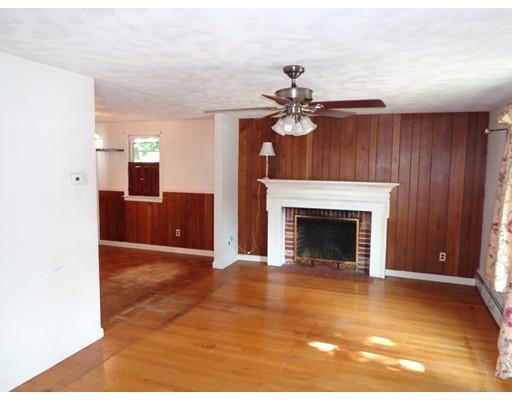 8 Russell Street Watertown, MA 02472 - Photo 2 of 9 a view of an empty room with a fireplace