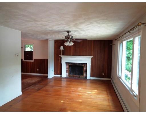 8 Russell Street Watertown, MA 02472 - Photo 3 of 9 a living room with furniture and a fireplace