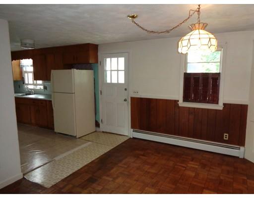 8 Russell Street Watertown, MA 02472 - Photo 6 of 9 a view of a kitchen with a refrigerator a kitchen a sink and dishwasher