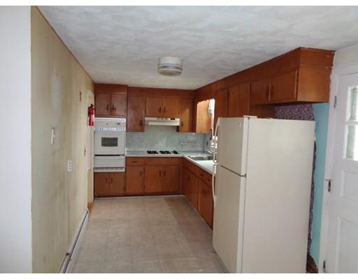 8 Russell Street Watertown, MA 02472 - Photo 7 of 9 a kitchen with stainless steel appliances a refrigerator and a sink