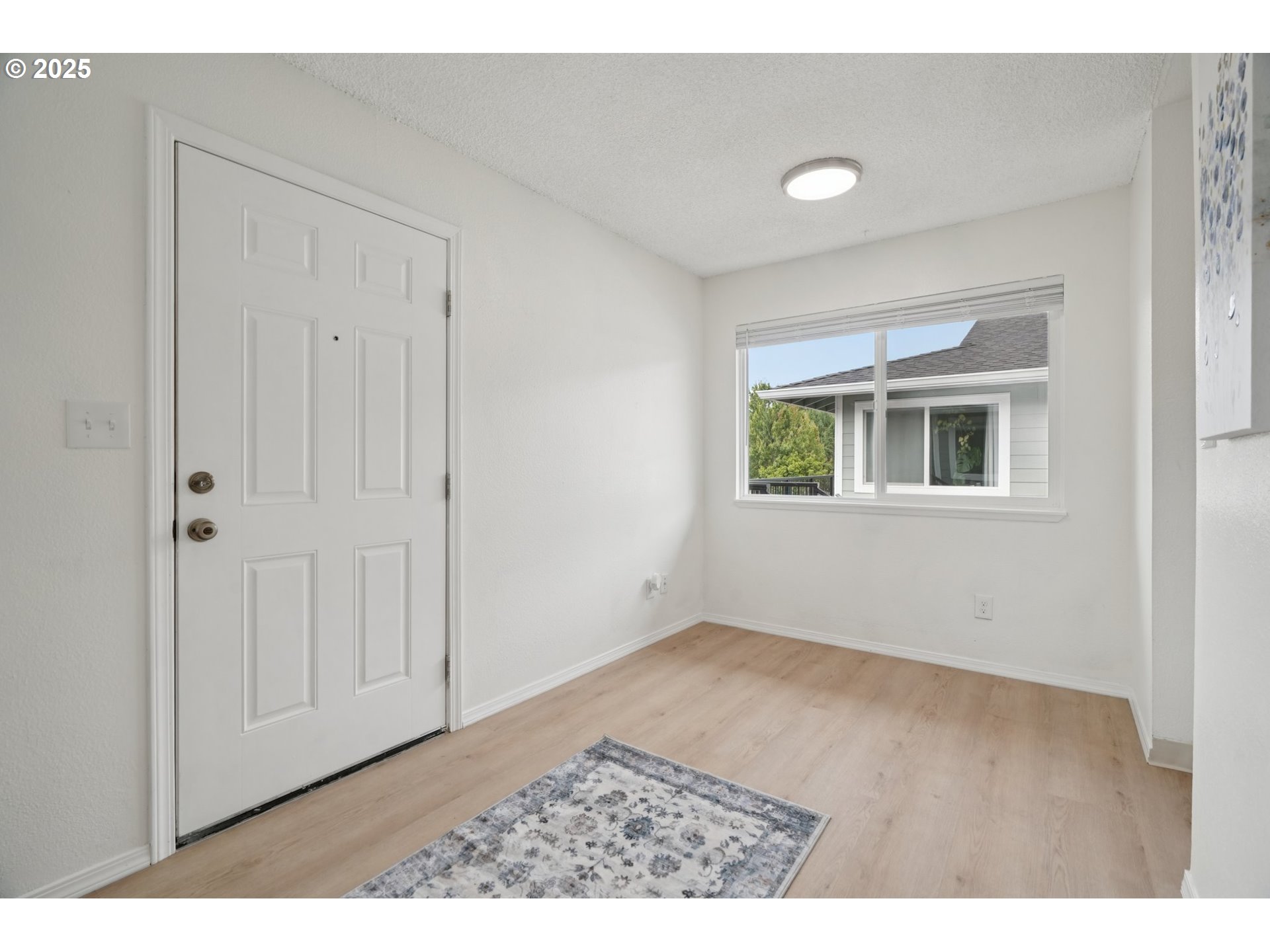 1495 Northeast Kane Drive Gresham, OR 97030 - Photo 12 of 48 a view of an empty room with a window