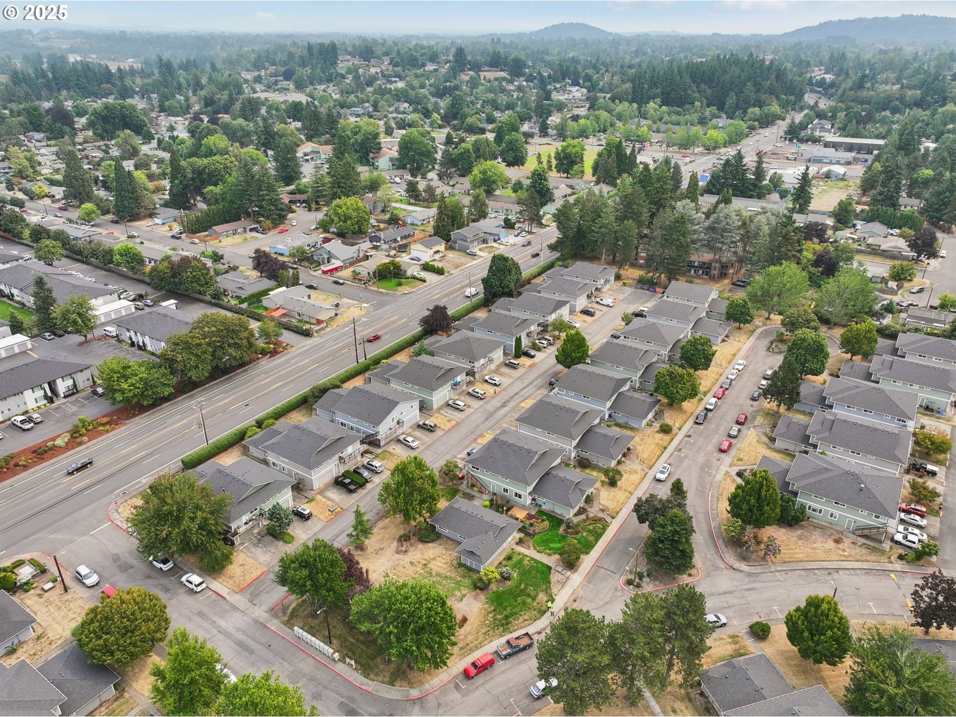1495 Northeast Kane Drive Gresham, OR 97030 - Photo 47 of 48 an aerial view of residential houses with outdoor space