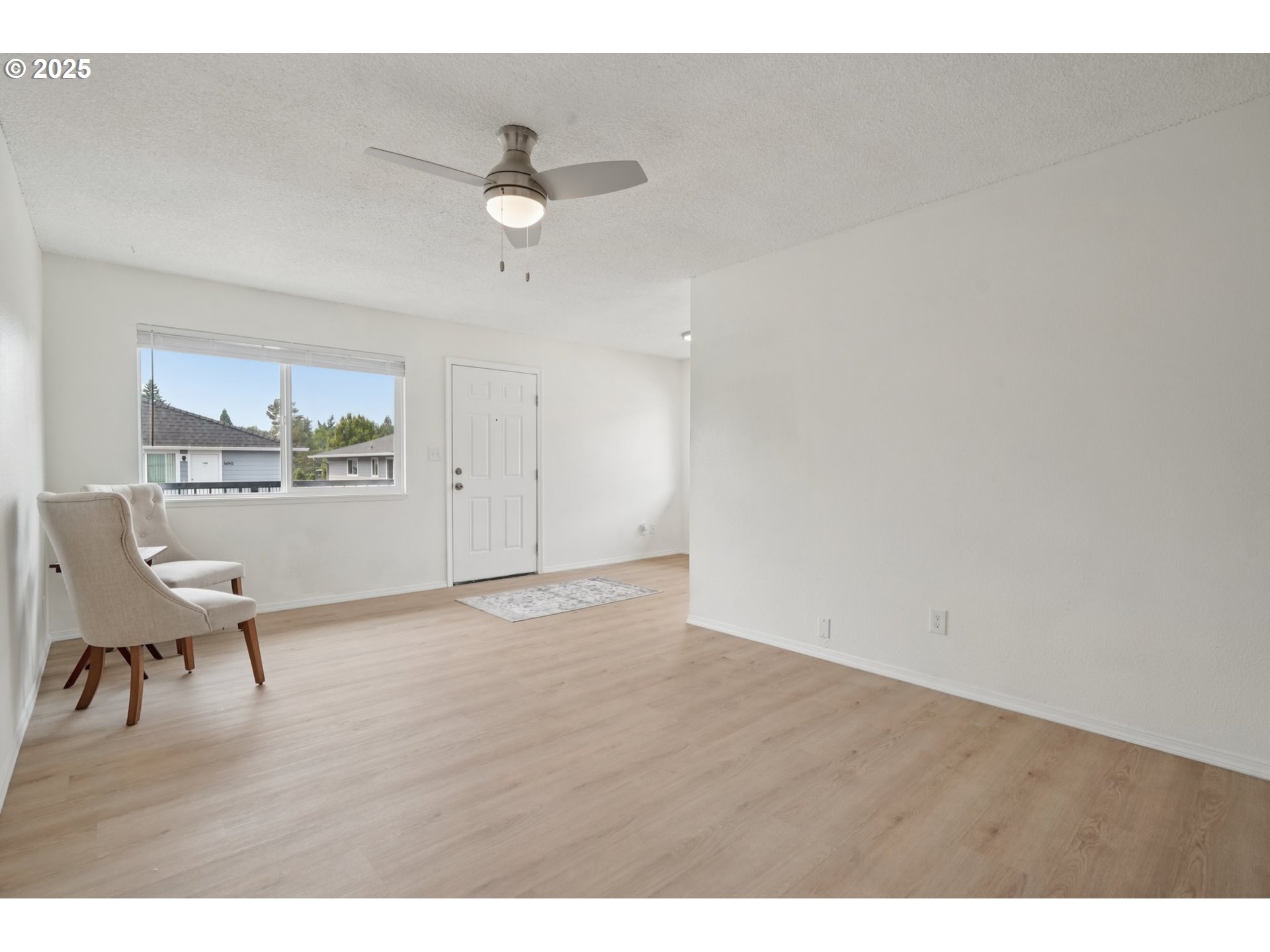 1495 Northeast Kane Drive Gresham, OR 97030 - Photo 8 of 48 a view of workspace with wooden floor and ceiling fan
