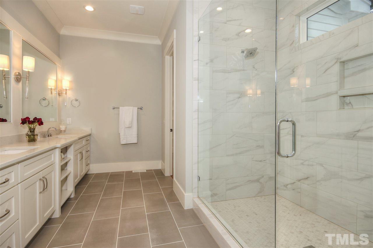 3311 Edgemont Drive Raleigh, NC 27612 - Photo 14 of 30 a bathroom with a double vanity sink toilet and shower