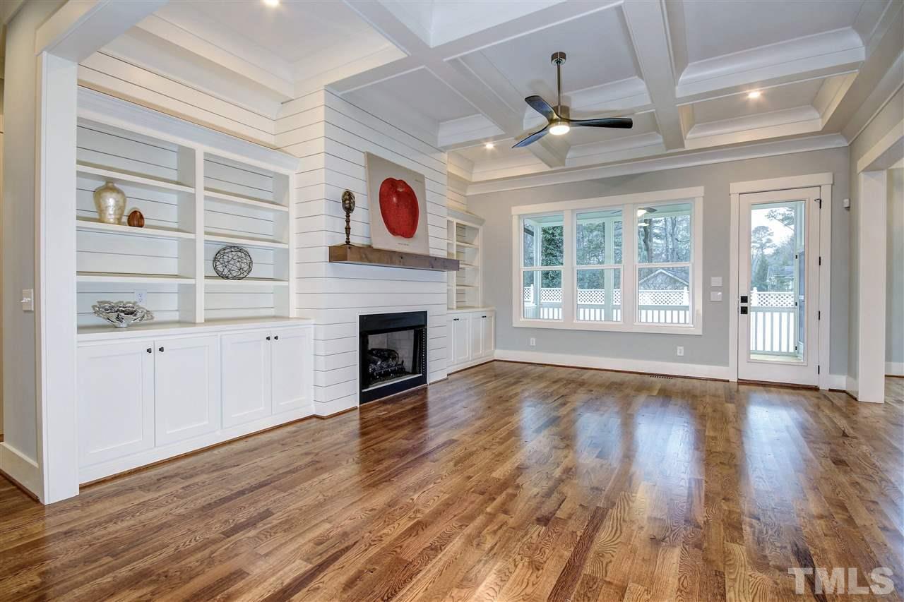3311 Edgemont Drive Raleigh, NC 27612 - Photo 3 of 30 a view of an empty room with wooden floor and a window