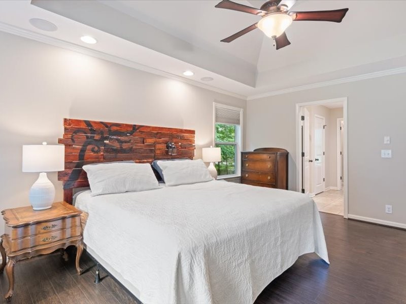 3904 Rowland Road Murfreesboro, TN 37128 - Photo 15 of 26 a bedroom with a bed and a chandelier