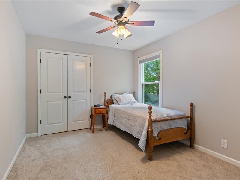 3904 Rowland Road Murfreesboro, TN 37128 - Photo 19 of 26 a bedroom with a bed and a chandelier