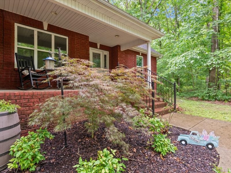 3904 Rowland Road Murfreesboro, TN 37128 - Photo 3 of 26 a backyard of a house with outdoor seating
