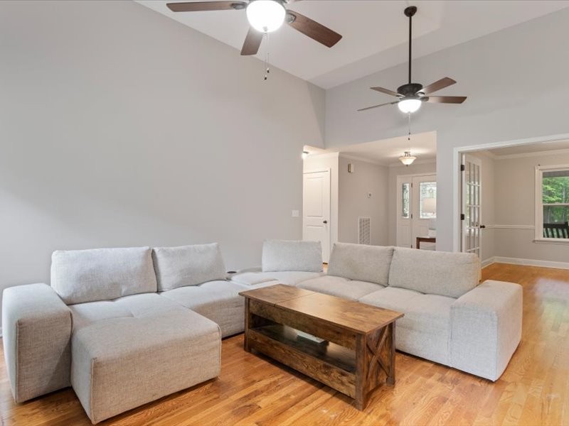 3904 Rowland Road Murfreesboro, TN 37128 - Photo 8 of 26 a living room with furniture and a chandelier