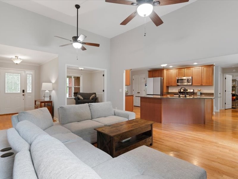 3904 Rowland Road Murfreesboro, TN 37128 - Photo 9 of 26 a living room with furniture kitchen view and a chandelier