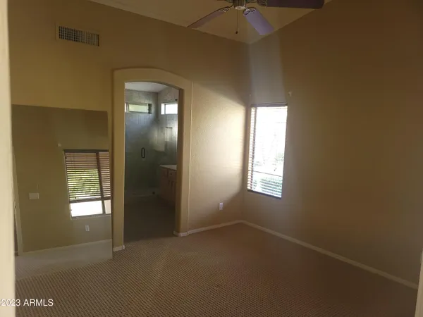 a view of empty room with windows