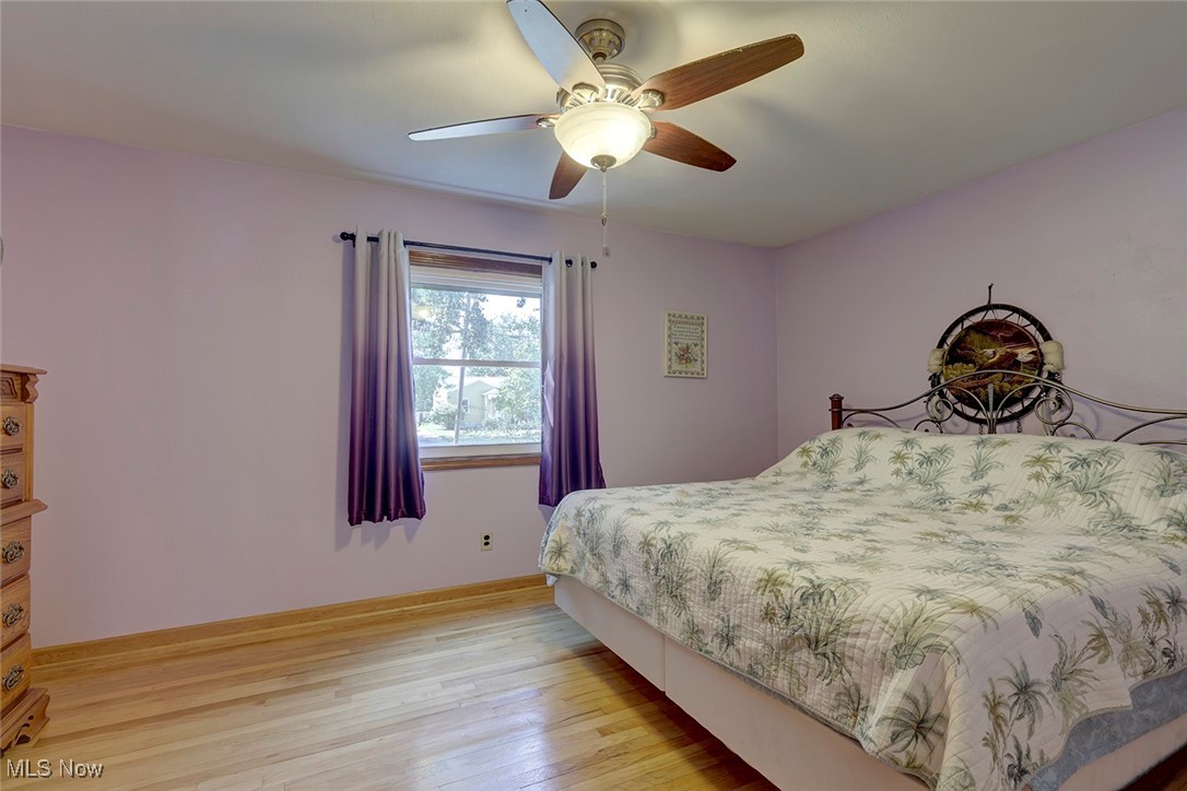 1525 Root Road Lorain, OH 44052 - Photo 17 of 41 Bedroom with light wood-type flooring and ceiling fan
