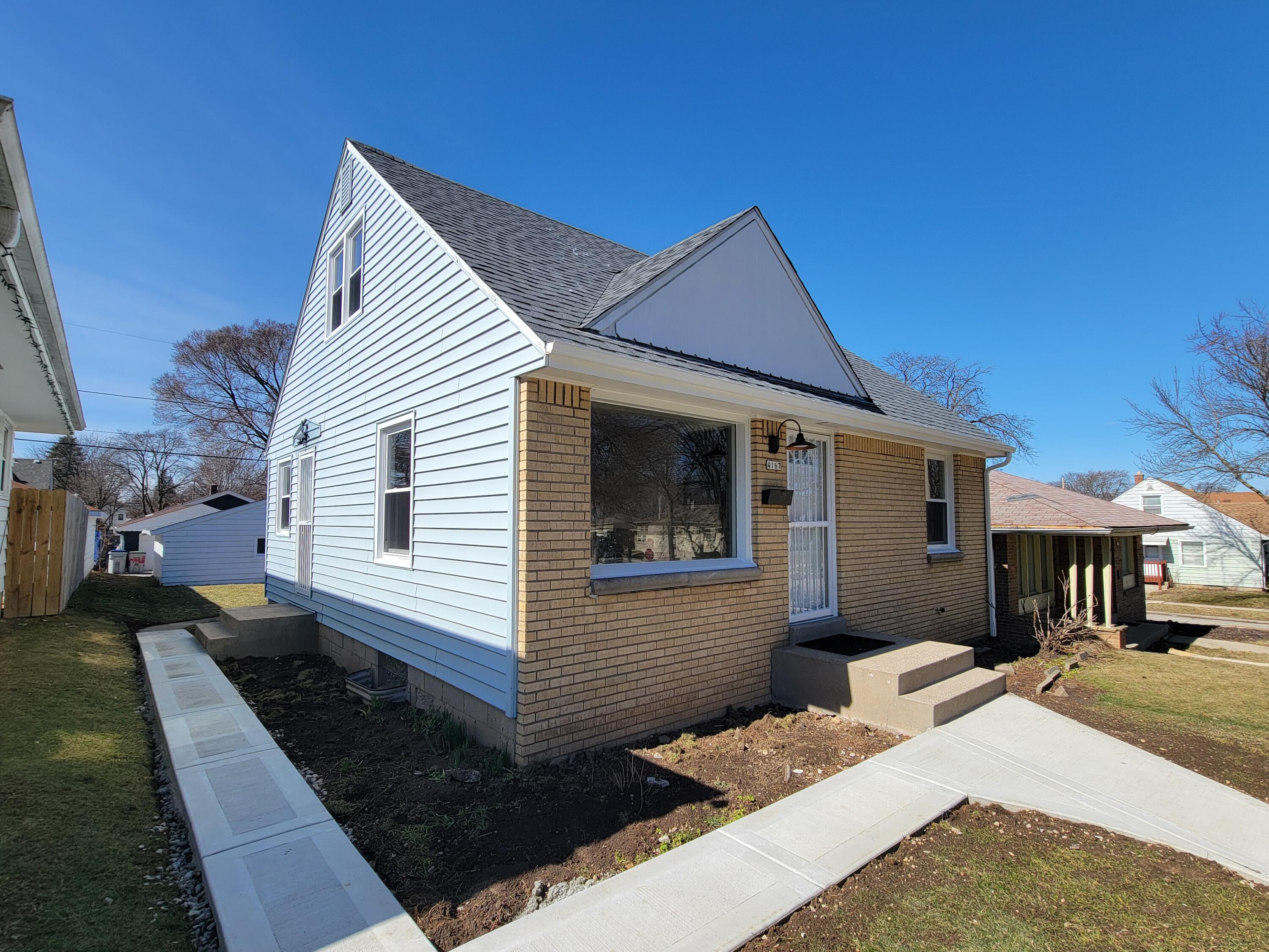4167 North 70th Street Milwaukee, WI 53216 - Photo 32 of 34 new concrete sidewalk