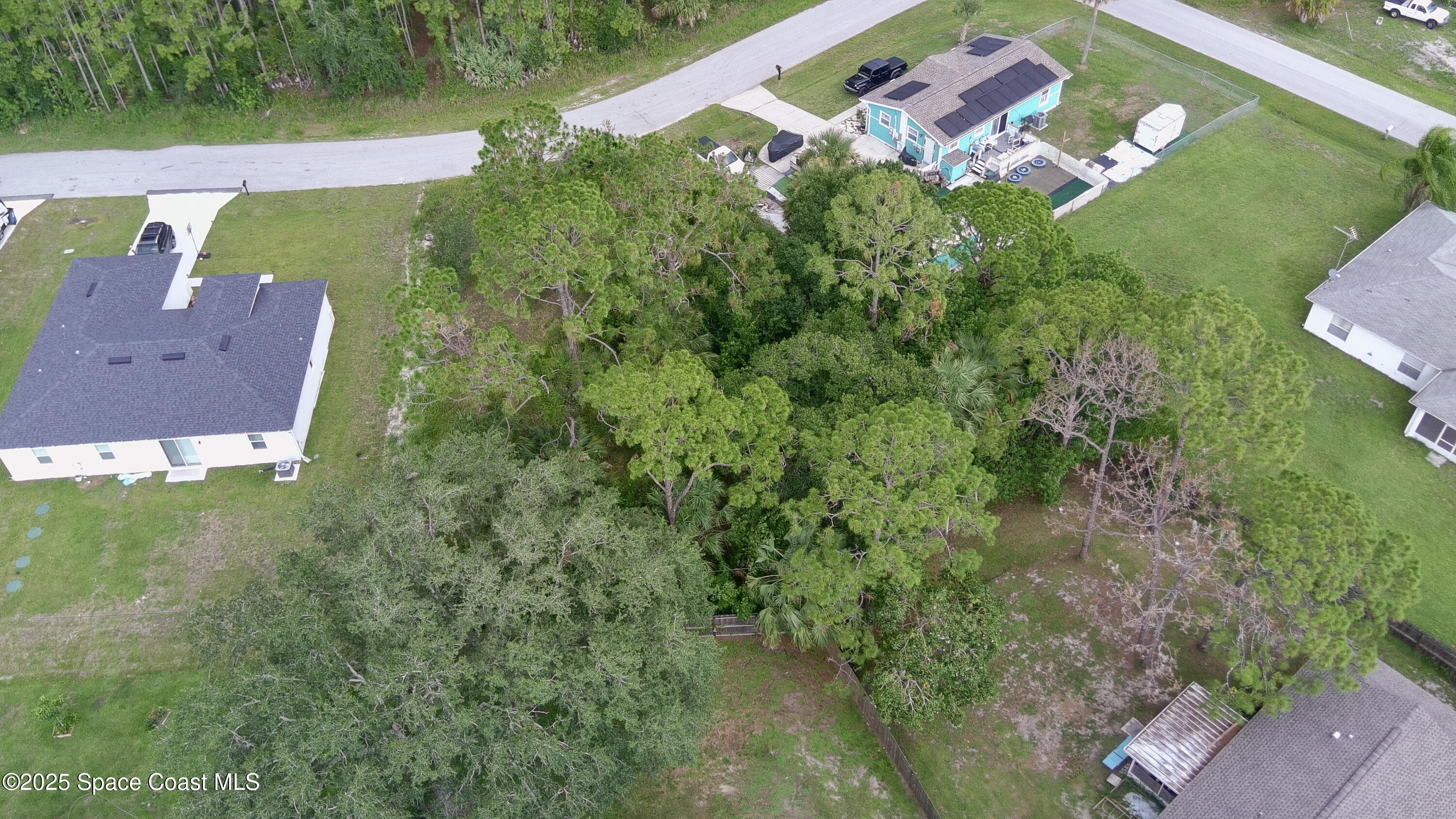 405 Tilhal Road Southwest Palm Bay, FL 32908 - Photo 11 of 13 an aerial view of a house with a yard