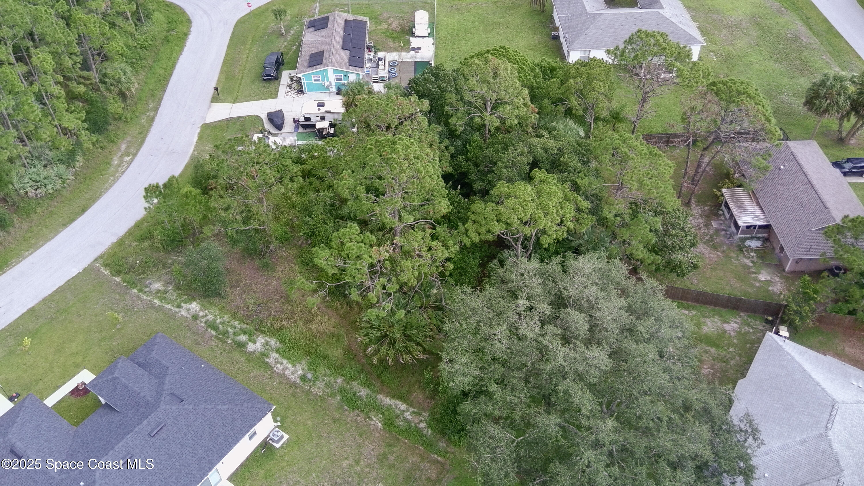 405 Tilhal Road Southwest Palm Bay, FL 32908 - Photo 13 of 13 an aerial view of a house with a yard