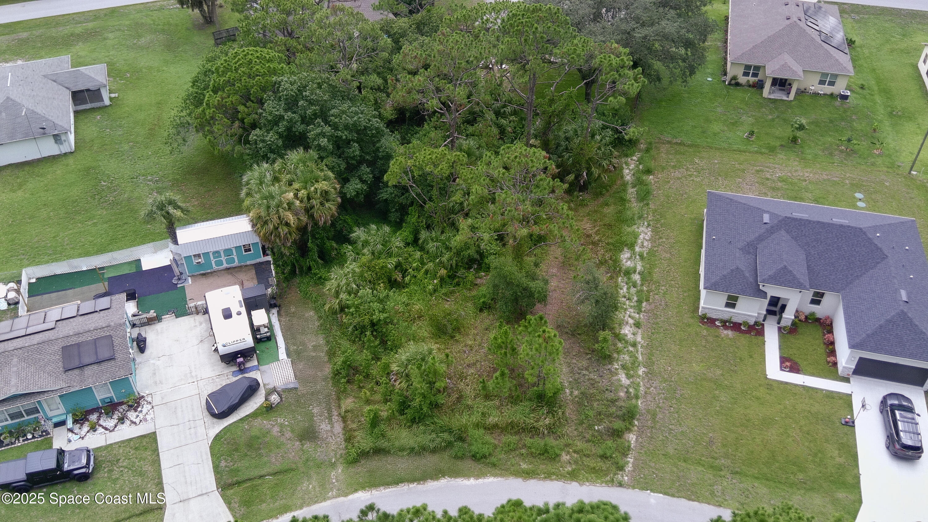 405 Tilhal Road Southwest Palm Bay, FL 32908 - Photo 5 of 13 an aerial view of a house with outdoor space