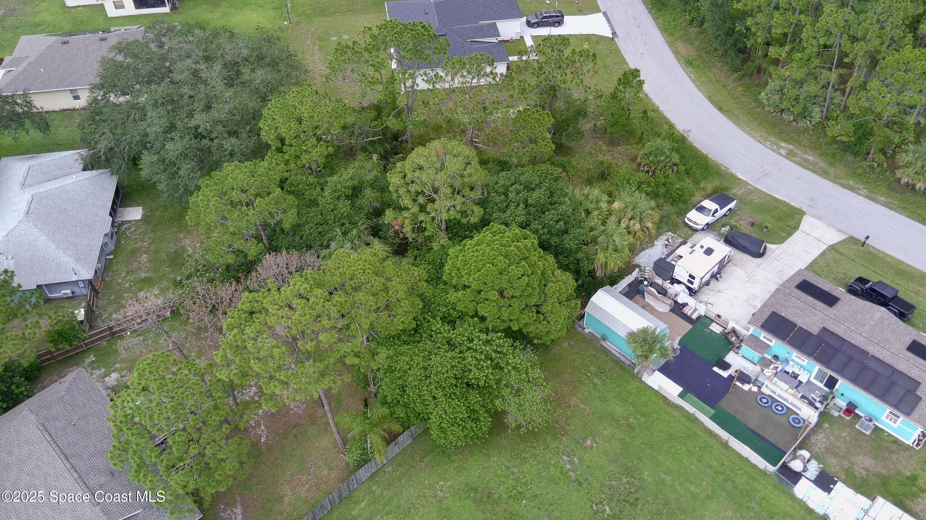 405 Tilhal Road Southwest Palm Bay, FL 32908 - Photo 7 of 13 an aerial view of a house with a yard