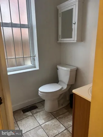 a bathroom with a toilet and a sink