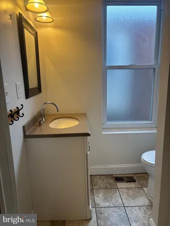 a bathroom with a sink and a toilet