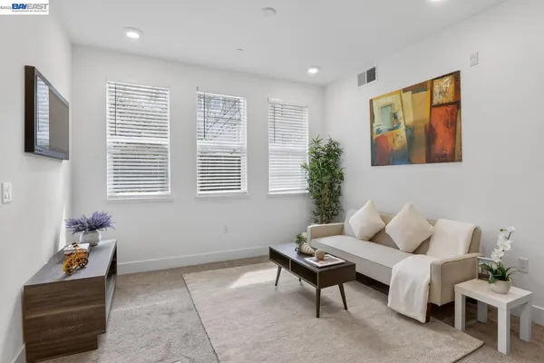 a living room with furniture and window