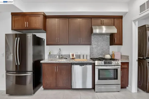 a kitchen with a stove microwave and refrigerator