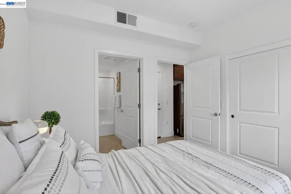 a bedroom with a bed and a closet