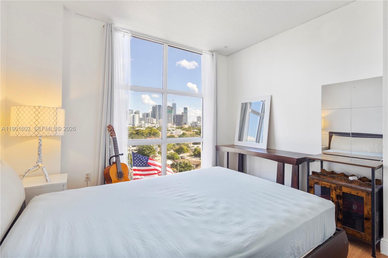 900 Southwest 8th Street, Unit 1009 Miami, FL 33130 - Photo 17 of 30 a bedroom with a bed and a window