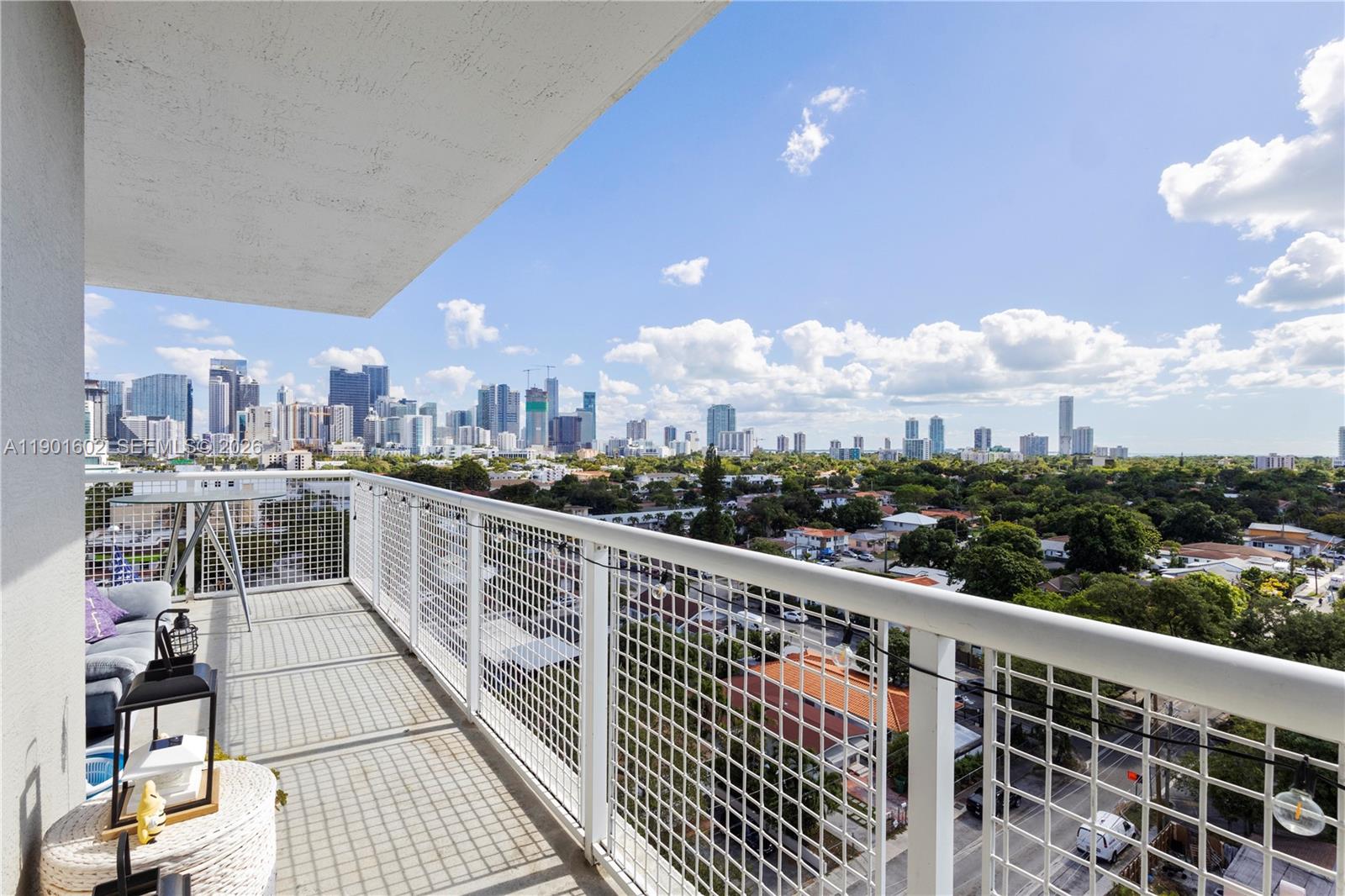 900 Southwest 8th Street, Unit 1009 Miami, FL 33130 - Photo 8 of 30 a view of a balcony with wooden floor