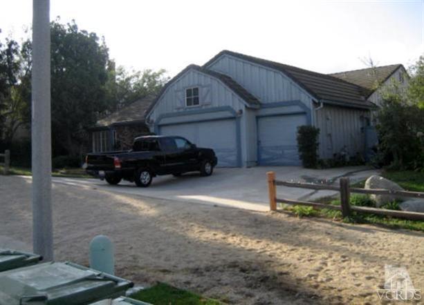 1848 Rocking Horse Drive Simi Valley, CA 93065 - Photo 2 of 8 a car parked in front of a house