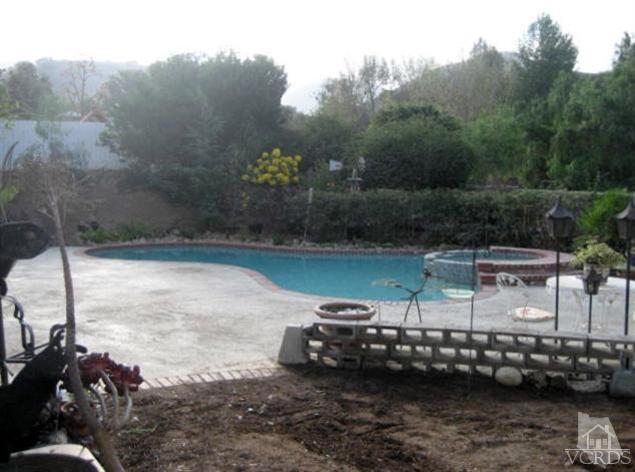 1848 Rocking Horse Drive Simi Valley, CA 93065 - Photo 3 of 8 a view of a lake with a bench