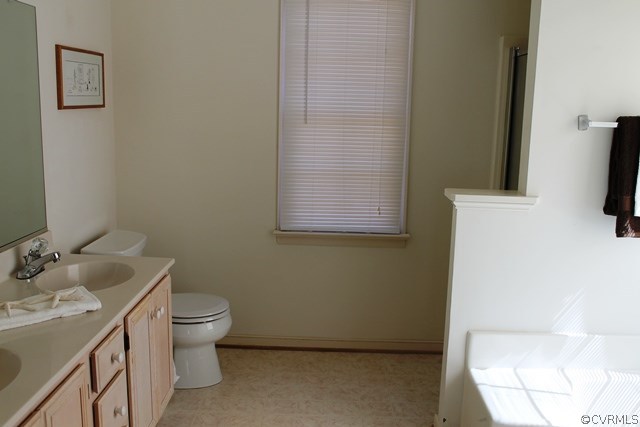 5405 Chestnut Bluff Road Midlothian, VA 23112 - Photo 12 of 19 a bathroom with a toilet sink and mirror