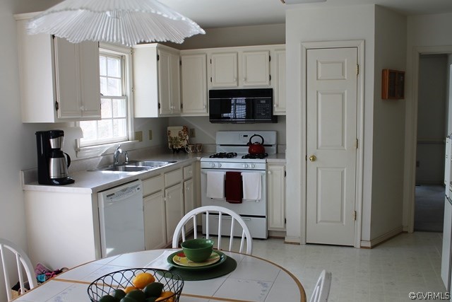 5405 Chestnut Bluff Road Midlothian, VA 23112 - Photo 6 of 19 a kitchen with stainless steel appliances kitchen island granite countertop a stove a sink and a refrigerator