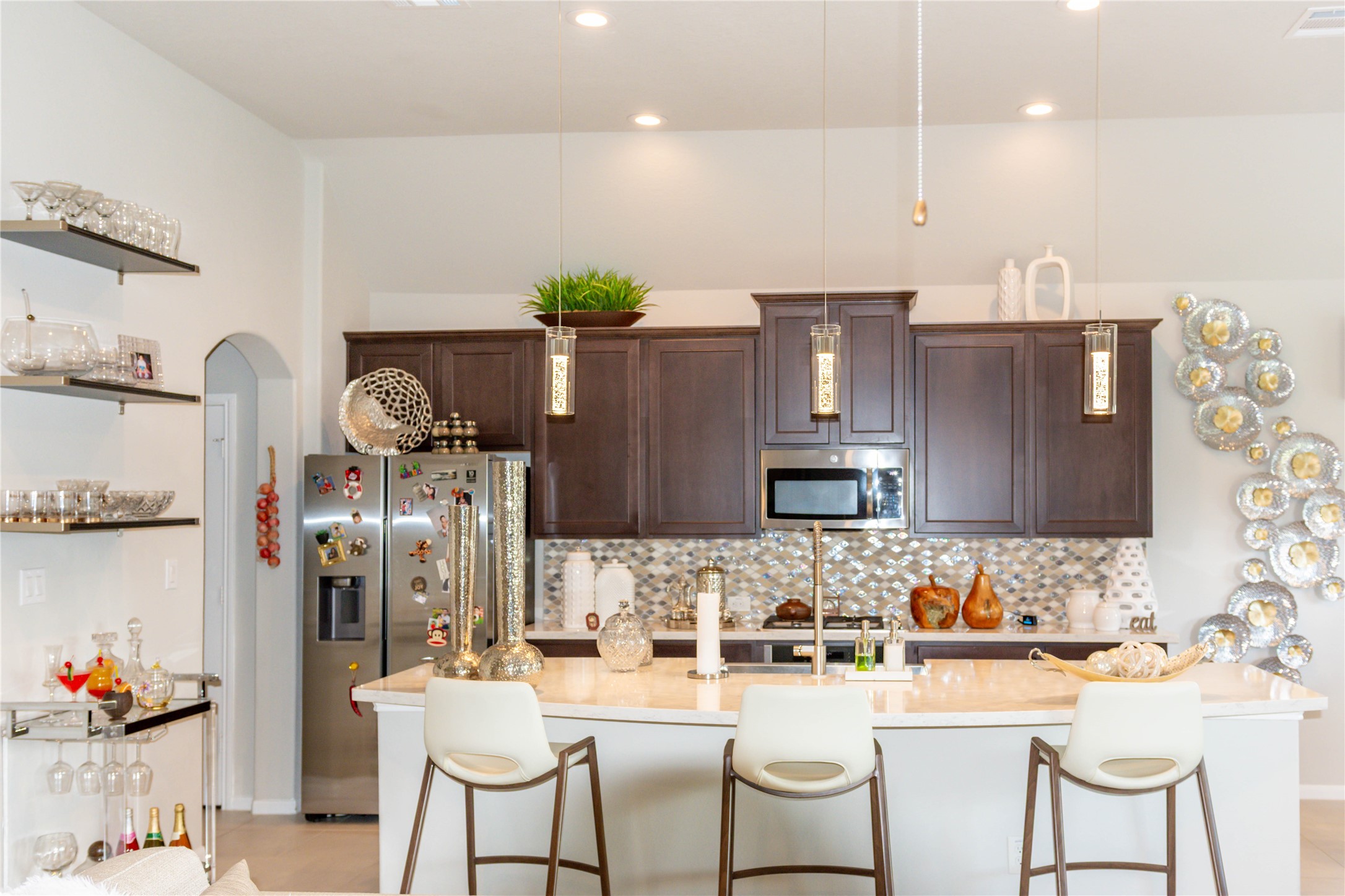 4306 Sandhill Terrace Lane Katy, TX 77493 - Photo 18 of 45 a kitchen with stainless steel appliances kitchen island granite countertop a refrigerator and a stove top oven