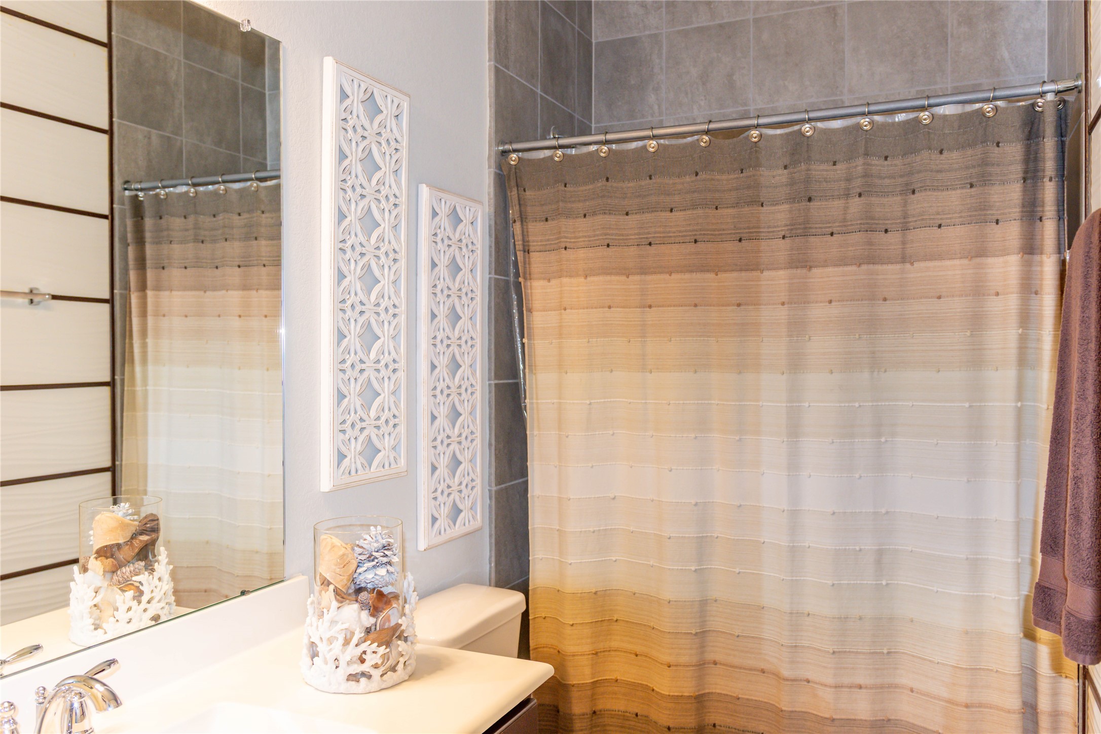 4306 Sandhill Terrace Lane Katy, TX 77493 - Photo 25 of 45 a bathroom with a shower curtain and a sink