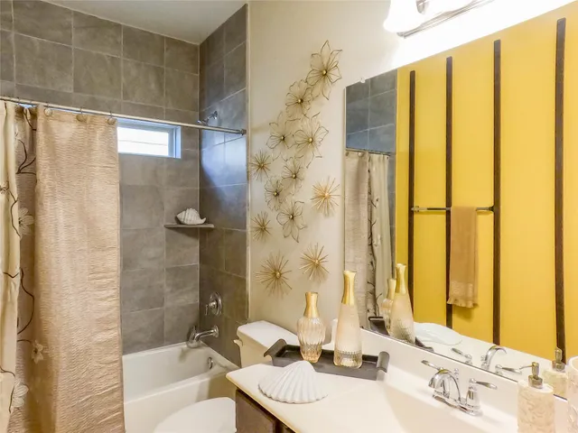 a bathroom with a sink and shower