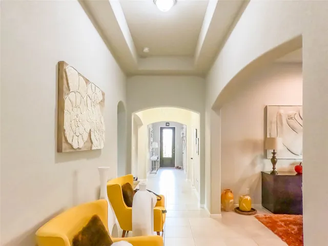 a large kitchen with kitchen island a stove a sink a dining table and chairs